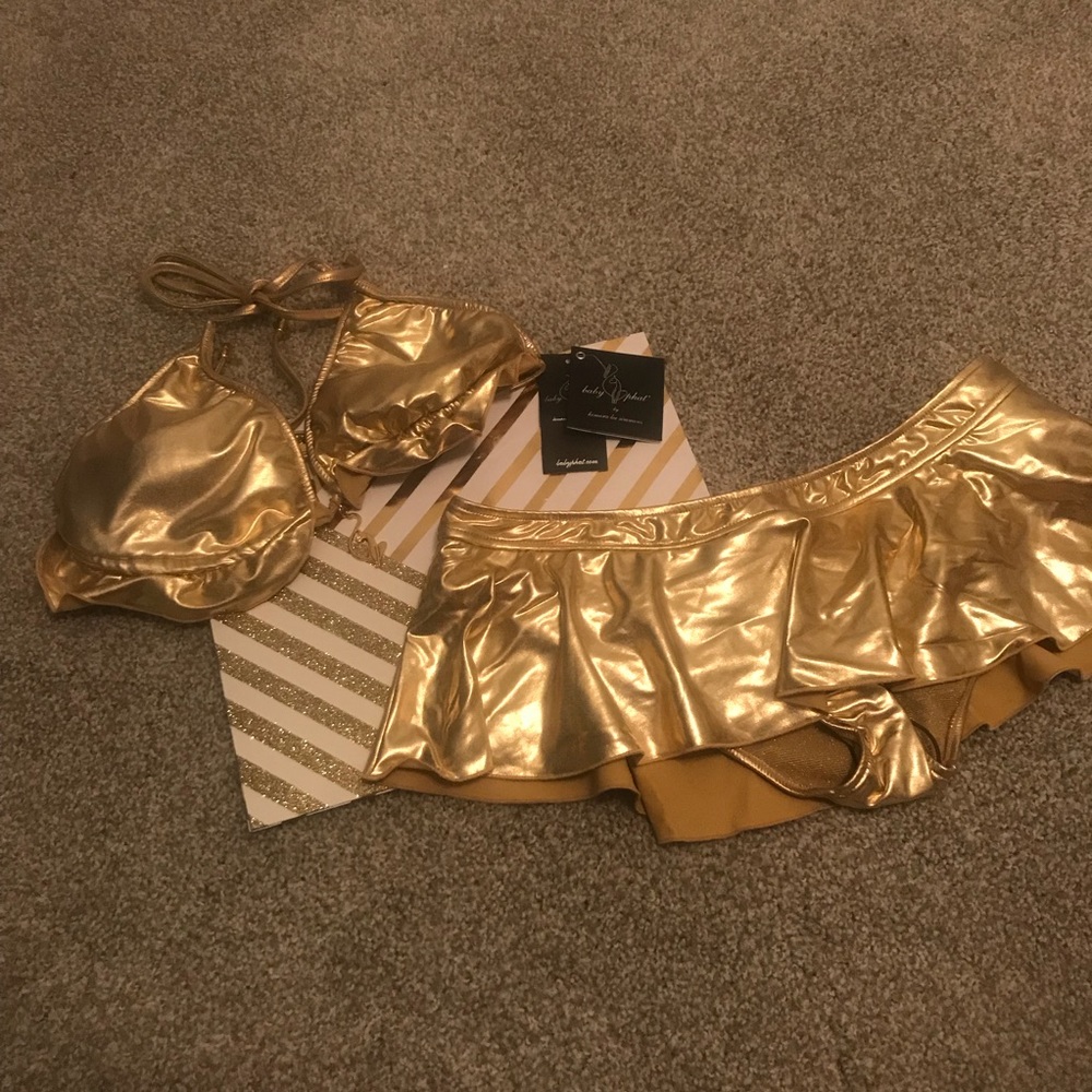 A 2-piece Baby Phat gold metallic bathing suit